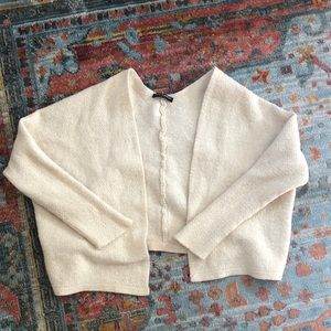 Brandy Melville cream colored cardigan sweater.